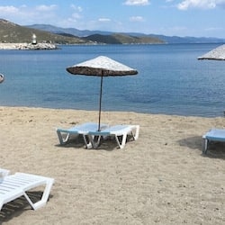 On the beach, sun loungers, beach umbrellas