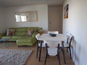 Apartment (2 Bedrooms) | Living area | 40-inch TV with cable channels, DVD player, toys