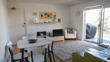 Apartment (2 Bedrooms) | Living area | 40-inch TV with cable channels, DVD player, toys