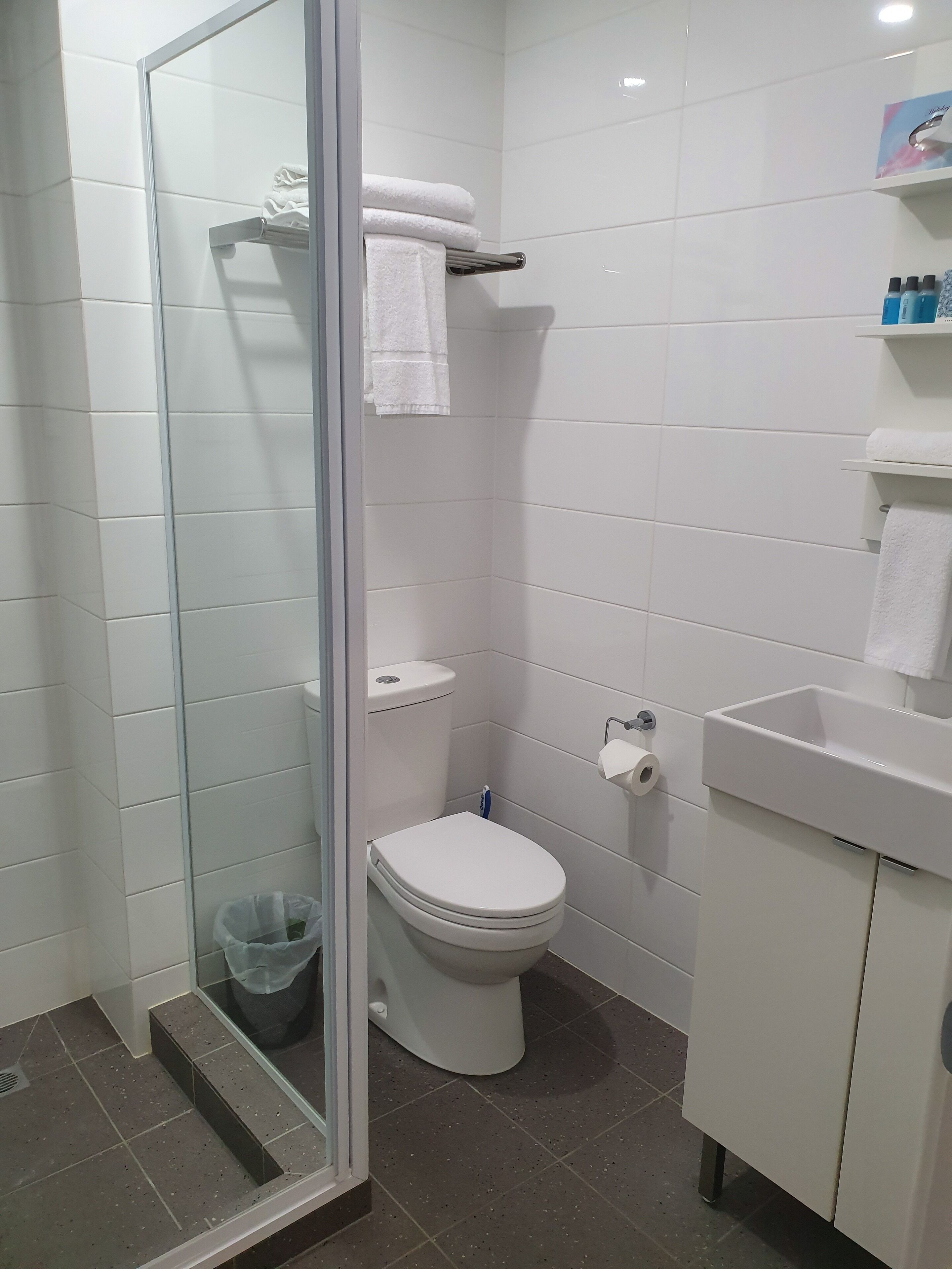 king room with balcony | bathroom | shower, towels, soap, shampoo