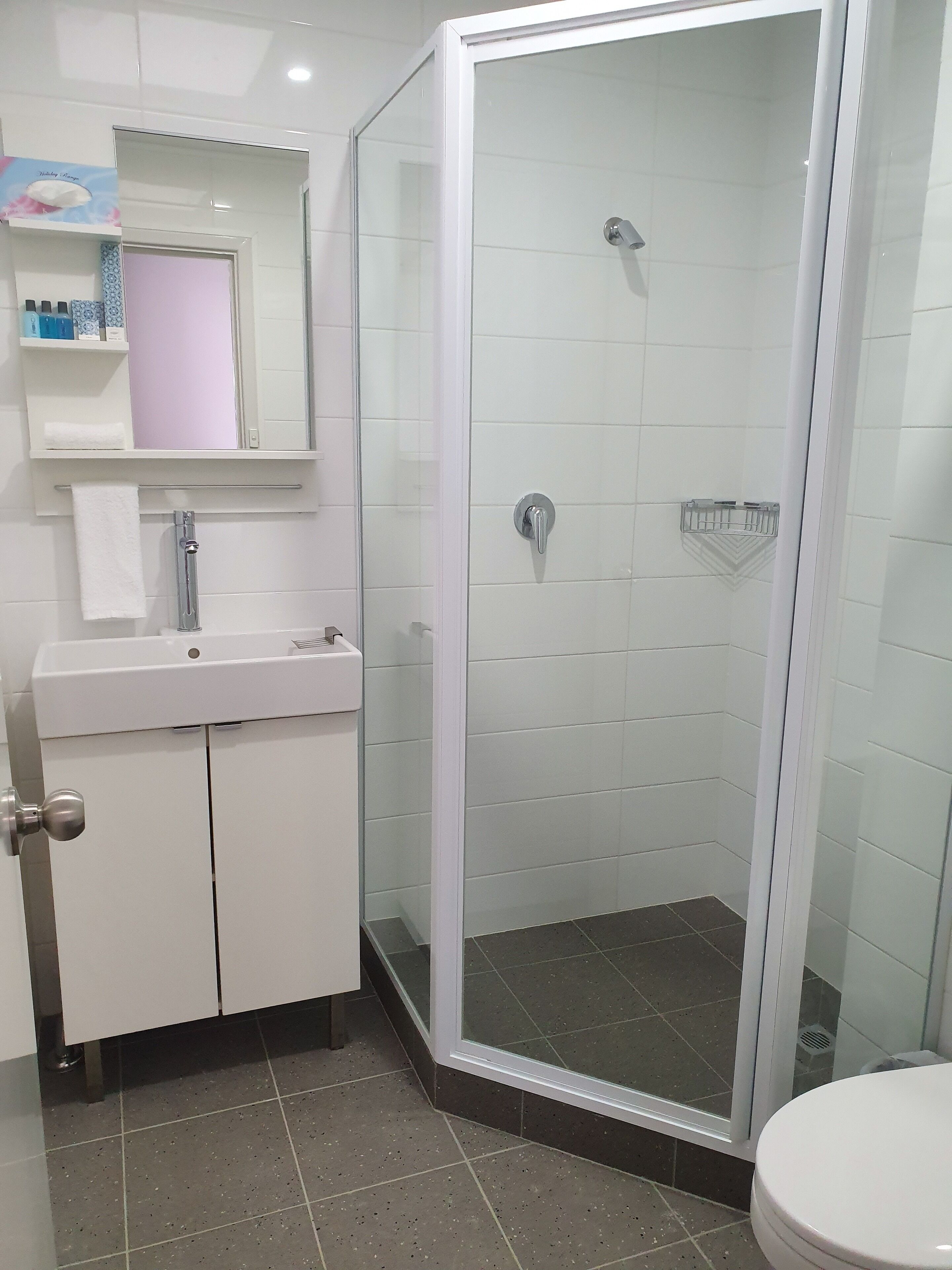 king room | bathroom | shower, towels, soap, shampoo