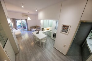 Apartment, 1 Bedroom, Balcony | Living area | 42-inch Smart TV with digital channels, TV, books - Artistic apartment in the middle of everything by VillaRentalsgr (Athens)