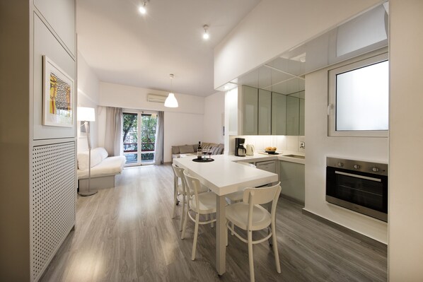Apartment, 1 Bedroom, Balcony | Living area | 42-inch Smart TV with digital channels, TV, books