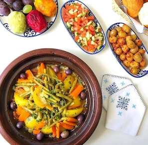 Breakfast, lunch, dinner served; local cuisine