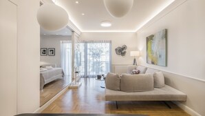 Lägenhet Executive - 1 kingsize-säng med bäddsoffa - bubbelbad - utsikt mot staden | Vardagsrum | Platt-tv, Netflix och streamingtjänster