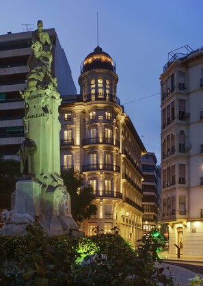 A historic building with ornate balconies and a statue in the foreground. - Casa Alberola Alicante, Curio Collection by Hilton (Alicante)