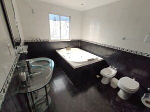 Deluxe Double Room | Bathroom | Bathtub, jetted tub, towels