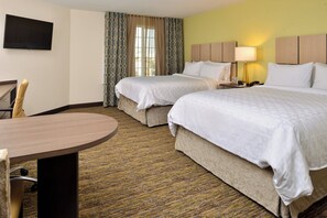 A hotel room with two beds, a desk, a TV, and a window with curtains. - Candlewood Suites Lodi by IHG (Lodi)