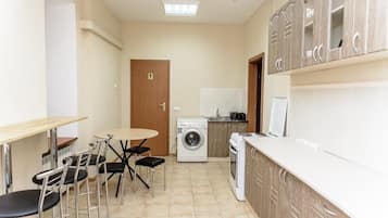 Full-size fridge, microwave, cookware/dishes/utensils