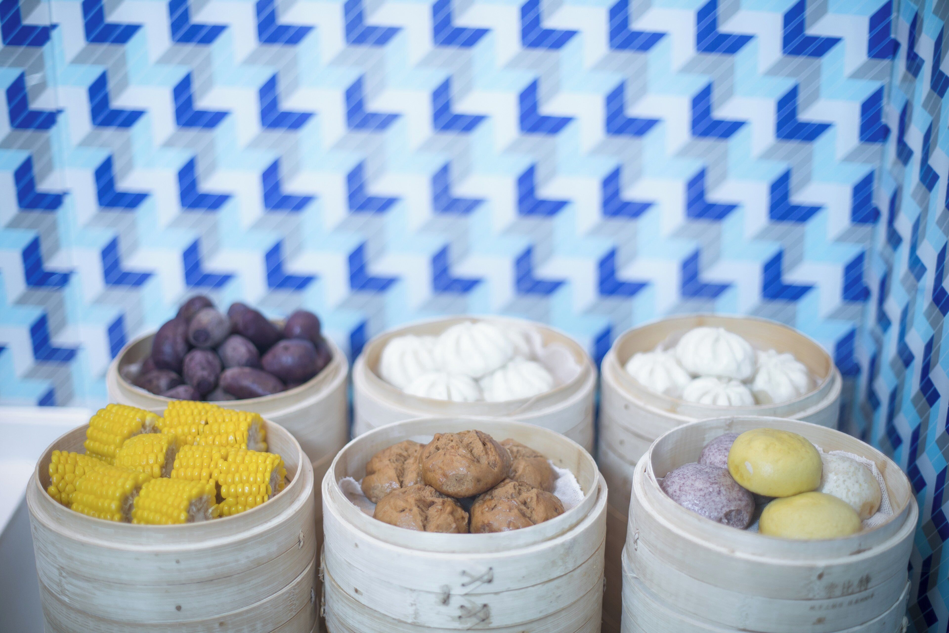 A display of food items in bamboo containers.