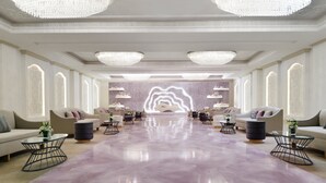 A spacious lobby with a marble floor, multiple seating areas, and large chandeliers. - Crowne Plaza Riyadh Al Waha by IHG (Riyadh)