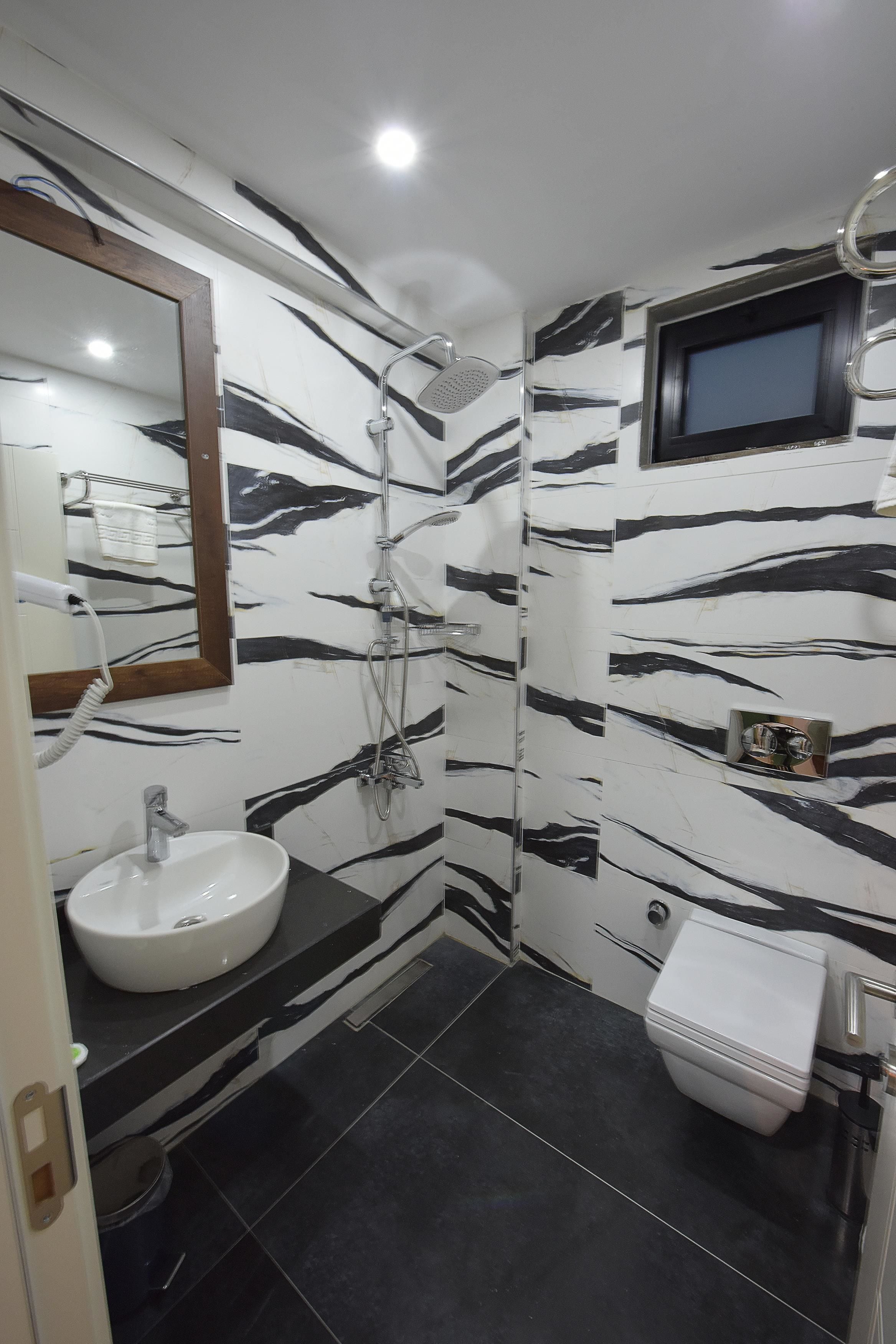 Shower, free toiletries, hair dryer, slippers