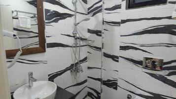 Shower, free toiletries, hair dryer, slippers