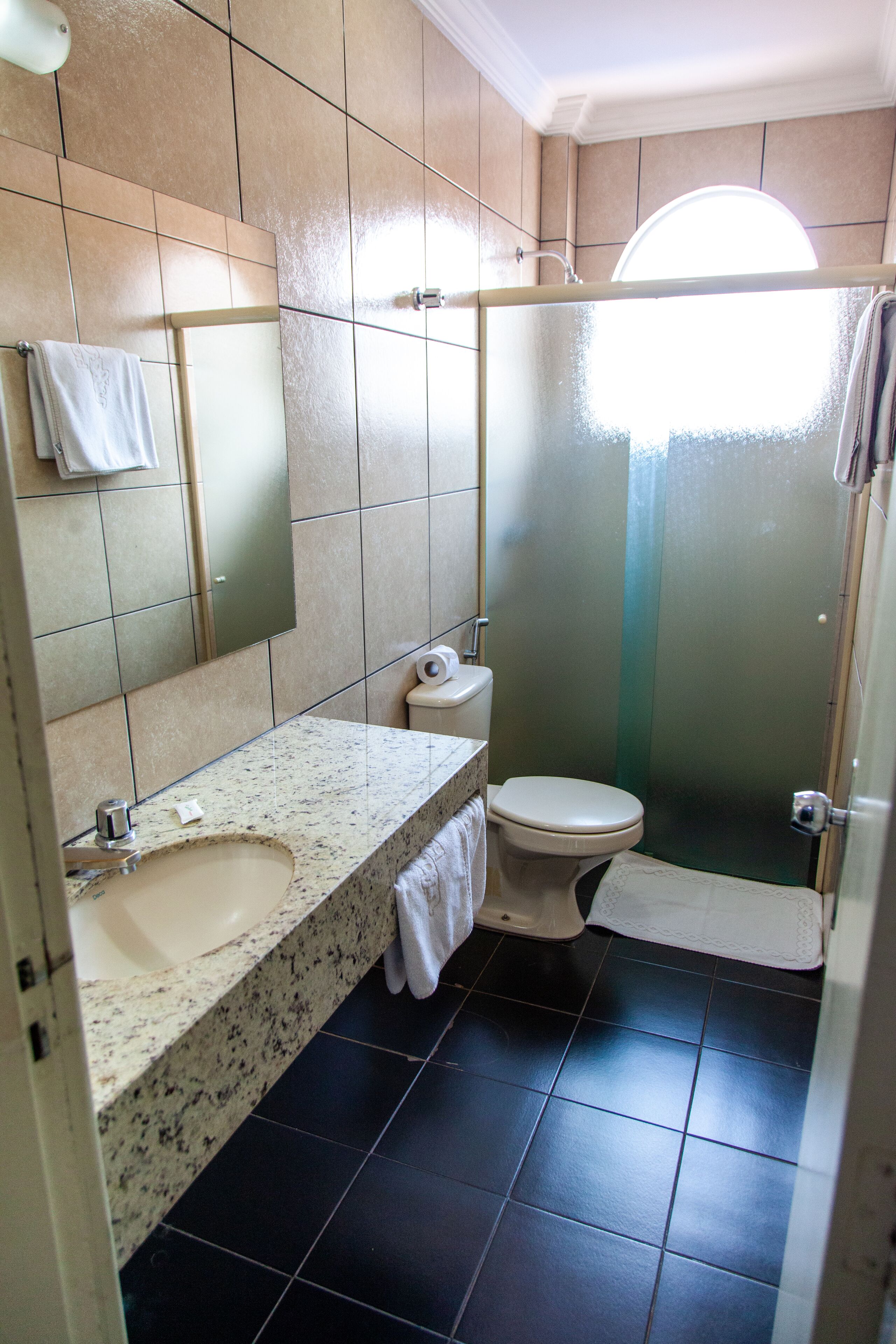 luxury single room | bathroom | shower, towels, soap, toilet paper