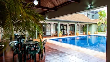 Indoor pool, outdoor pool, open 9:00 AM to 9:00 PM, pool loungers