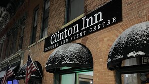A brick building with a sign for Clinton Inn, featuring a wedding and event center. - The Clinton Inn (Clinton)