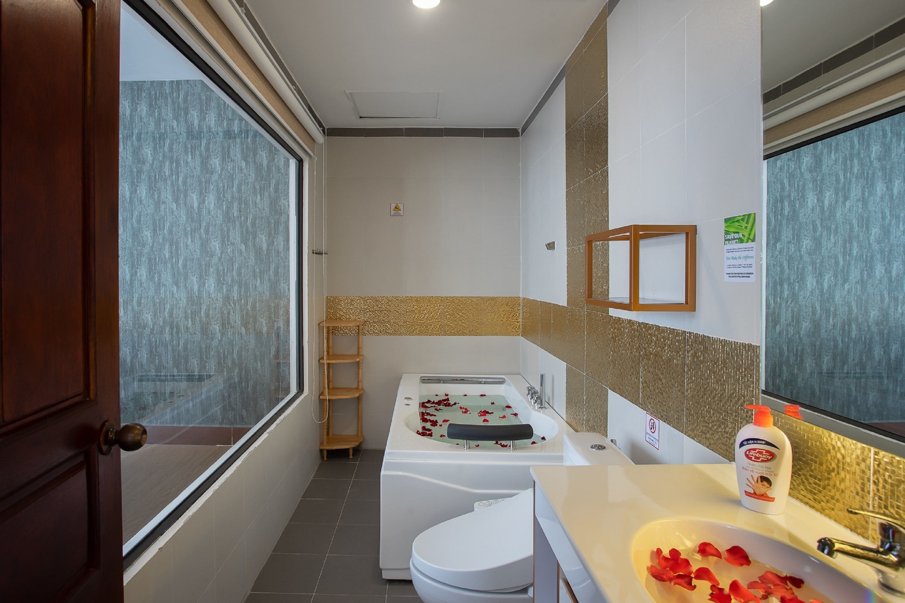 combined shower/bathtub, deep-soaking bathtub, designer toiletries