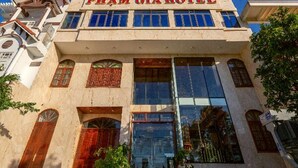 A hotel with a prominent sign reading "PHAM GIAP HOTEL".
