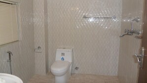 A bathroom with a toilet, shower, and sink. - Heritage De Patan (Lalitpur)
