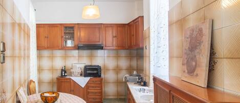 Apartment, 2 Bedrooms | Private kitchen | Full-size fridge, oven, stovetop, coffee/tea maker