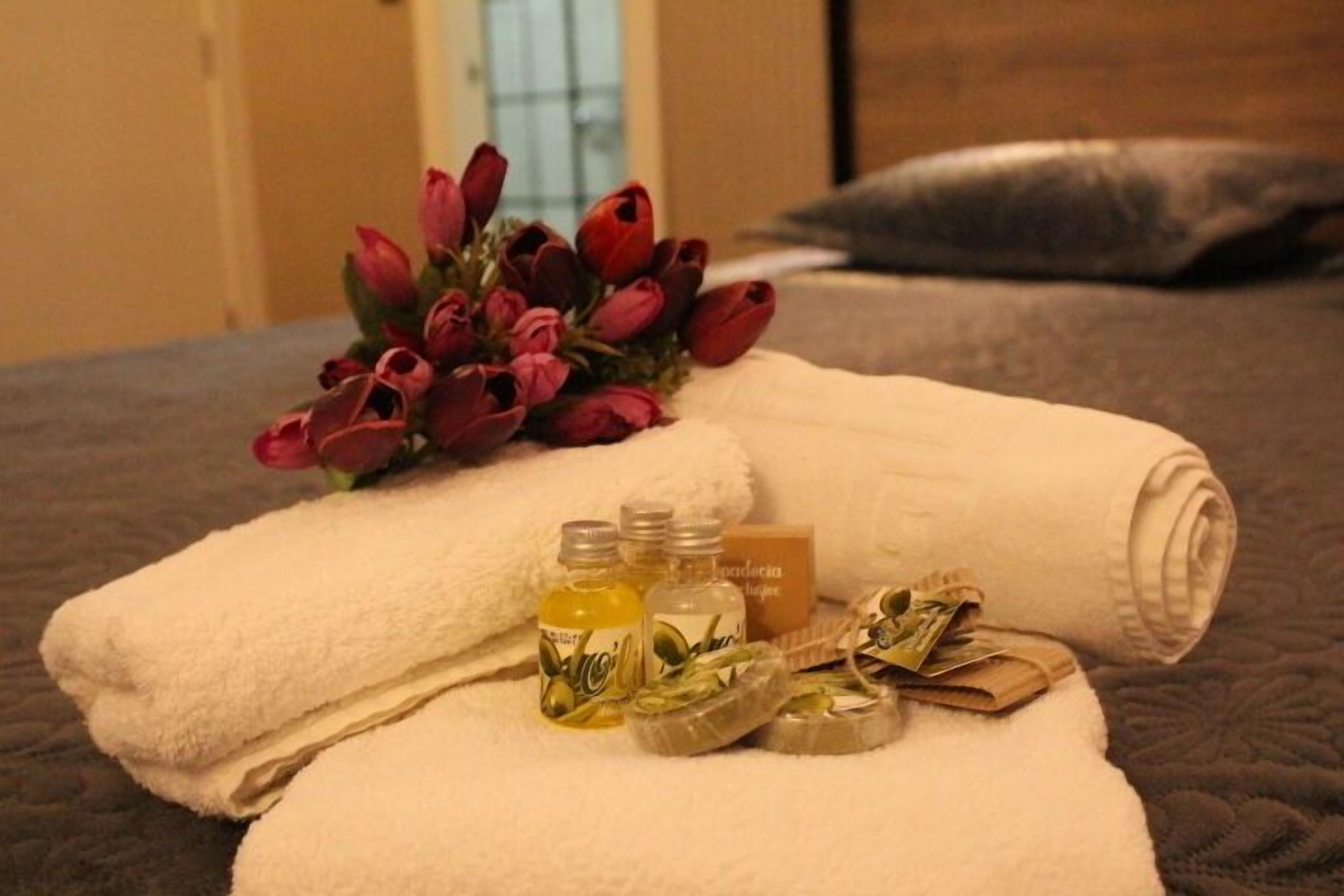 family suite, multiple beds | bathroom | shower, slippers, towels