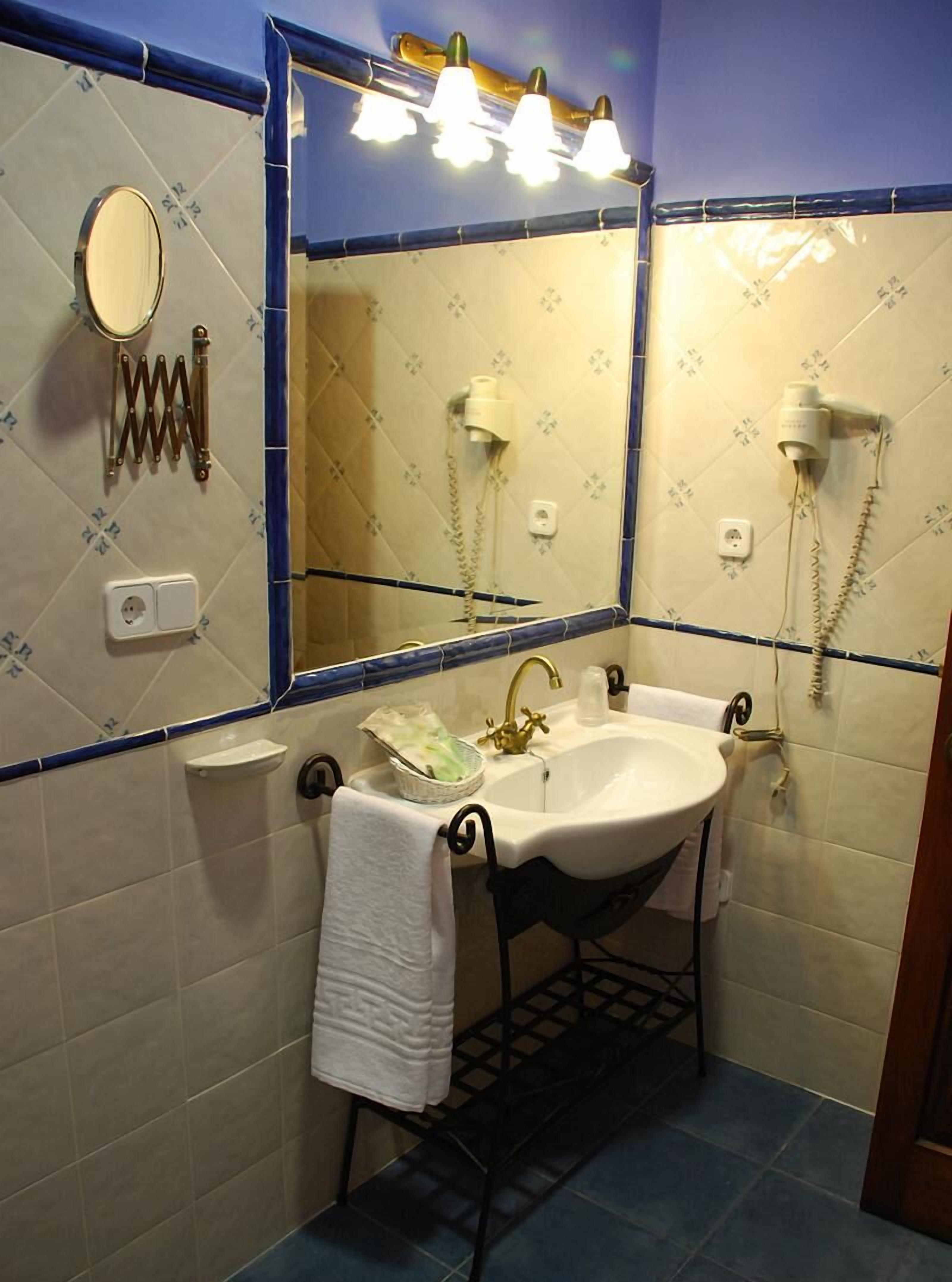 hair dryer, bathrobes, slippers, towels