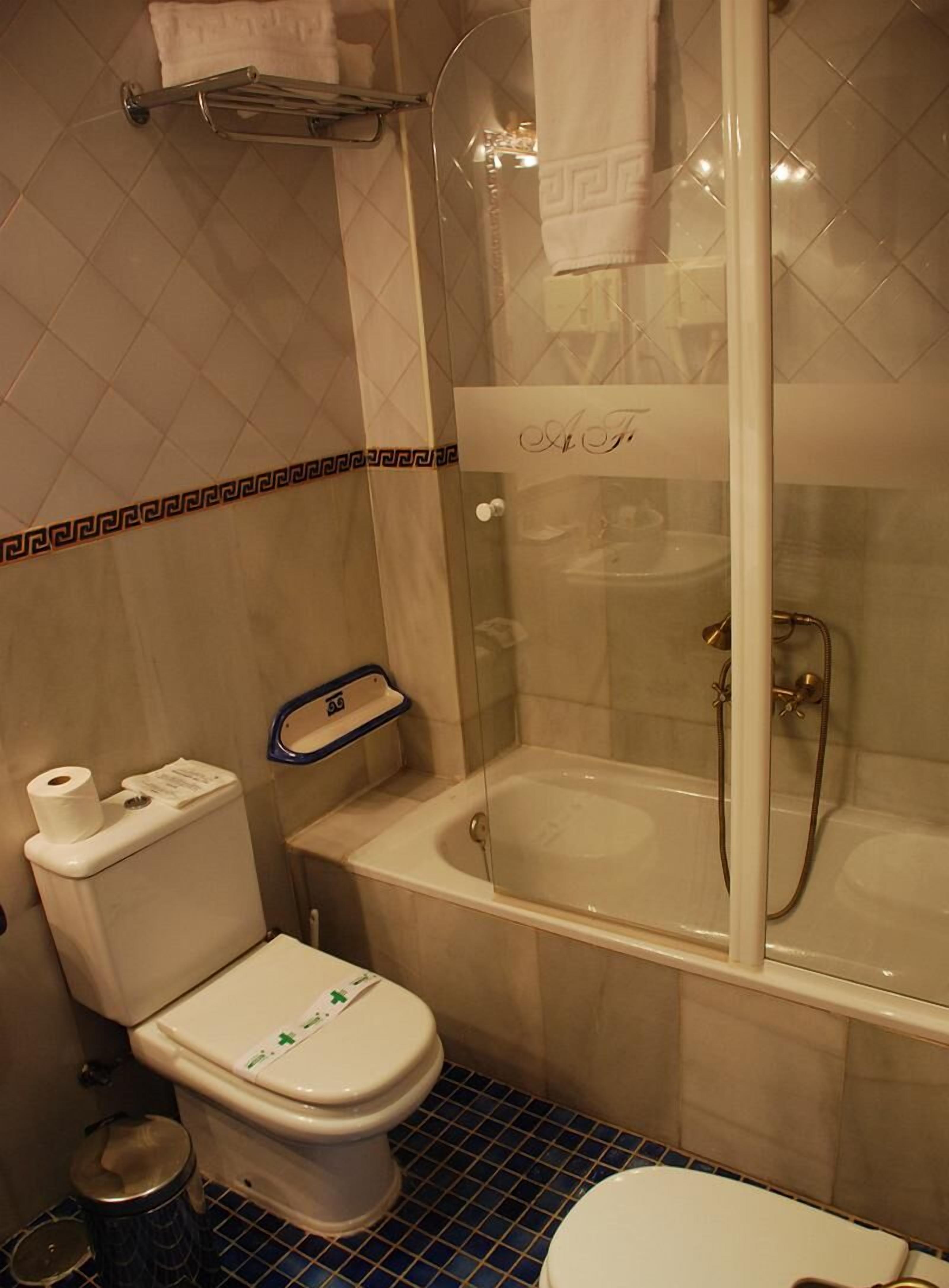 junior suite | bathroom | hair dryer, bathrobes, slippers, towels