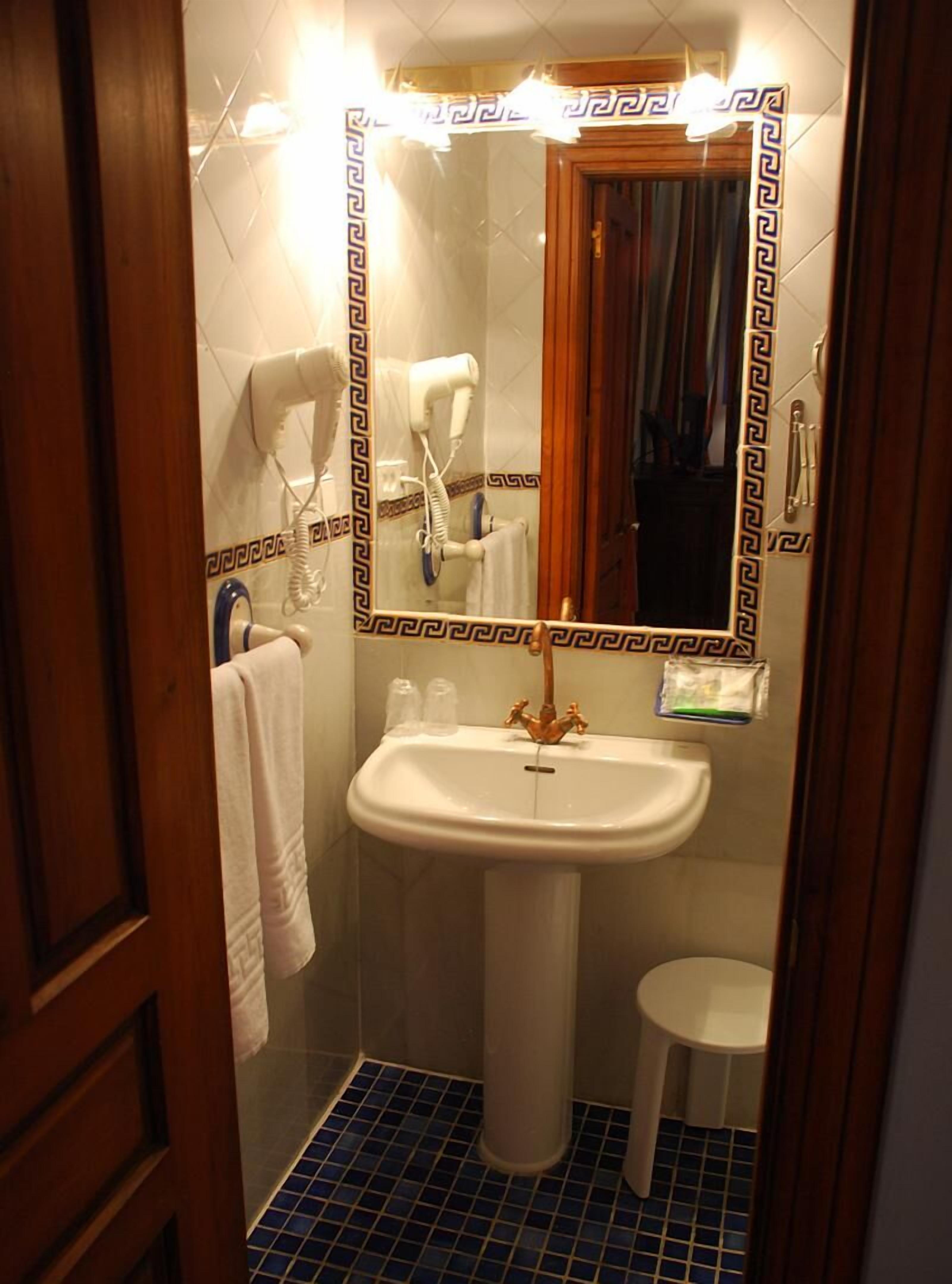 hair dryer, bathrobes, slippers, towels