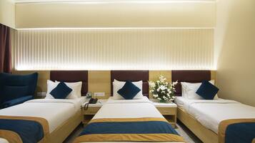 Executive Triple Room | 1 bedroom, down comforters, memory foam beds, minibar