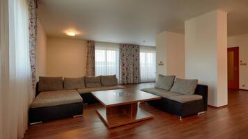 Luxury Suite, Kitchenette | In-room safe, desk, laptop workspace, blackout curtains