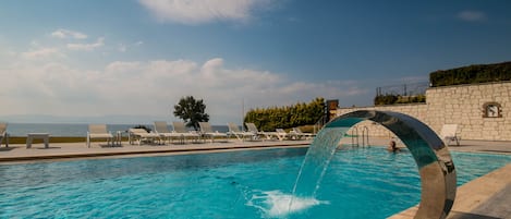 Seasonal outdoor pool, open 8:30 AM to 10:00 PM, sun loungers