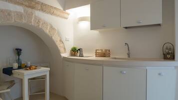 Apartment, 1 Bedroom | Private kitchenette | Full-size fridge, stovetop, coffee/tea maker, electric kettle