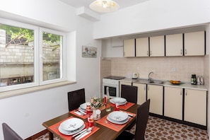 Apartment (Two Bedroom Apartment with Terrace) | Private kitchen | Fridge, microwave, stovetop, electric kettle