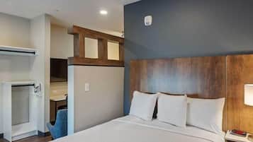 Premium bedding, desk, laptop workspace, iron/ironing board