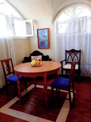 Traditional Suite, 1 Bedroom | Living area | 32-inch flat-screen TV with cable channels, TV - Loukas Kontos Traditional House (Santorini)