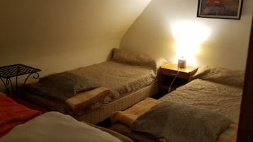 1 bedroom, desk, iron/ironing board, travel crib