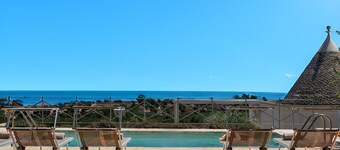 Complex of trulli with private pool overlooking the sea
