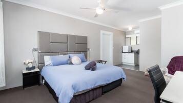 Deluxe King Studio | Premium bedding, pillowtop beds, desk, laptop workspace