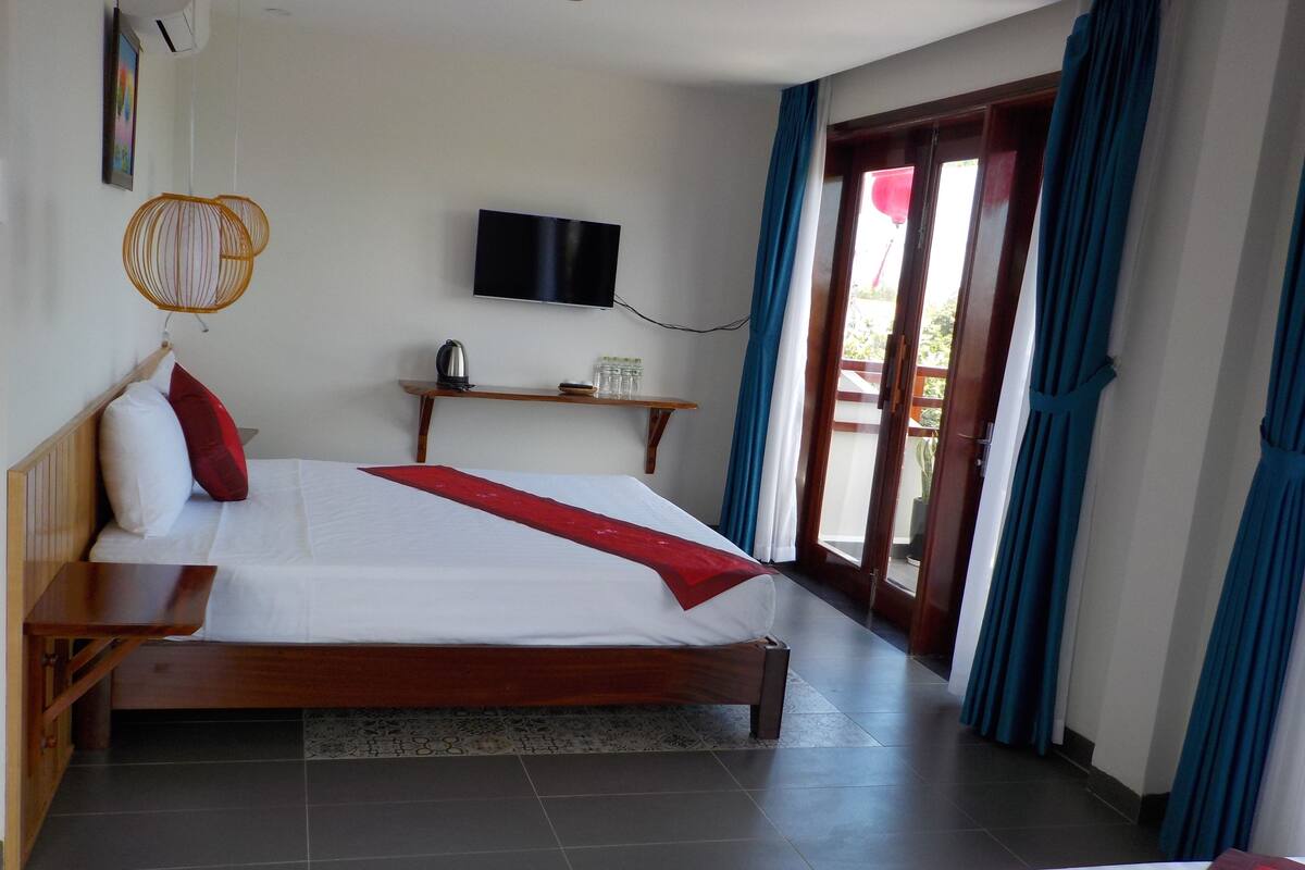 Deluxe vierpersoonskamer | Select Comfort-bedden, een minibar, een kluis op de kamer