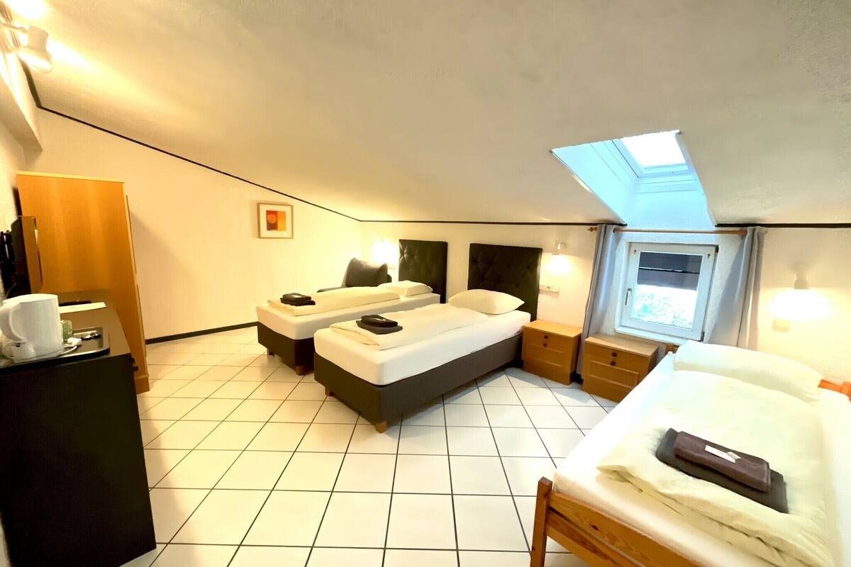 Standard Triple Room | 2 bedrooms, bed sheets