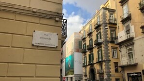 A street view with a building labeled "VIA STENDHAL" and "QUARTIERE SAN GIUSEPPE".