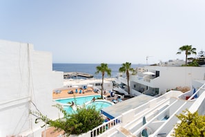 Outdoor pool - Studio , southfacing sea views , own patio, 2 heated pools, overlooking harbour (Puerto del Carmen)
