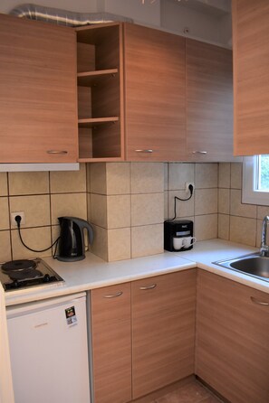 Studio | Private kitchenette | Fridge, stovetop, cookware/dishes/utensils - Small & Cozy Flat near Hospitals (Zografos)