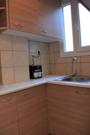 Studio | Private kitchenette | Fridge, stovetop, cookware/dishes/utensils - Small & Cozy Flat near Hospitals (Zografos)