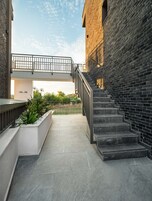 A modern building with a staircase leading to an upper level.