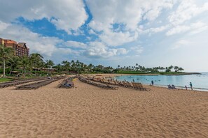 On the beach, sun loungers, beach towels