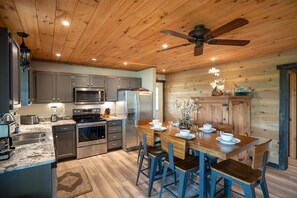 Enjoy meals in the kitchen with stainless steel appliances and a dishwasher, and dine at the wooden table for four.