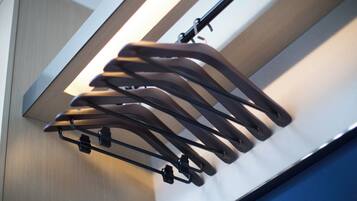 A wall-mounted rack with multiple hooks for hanging items.