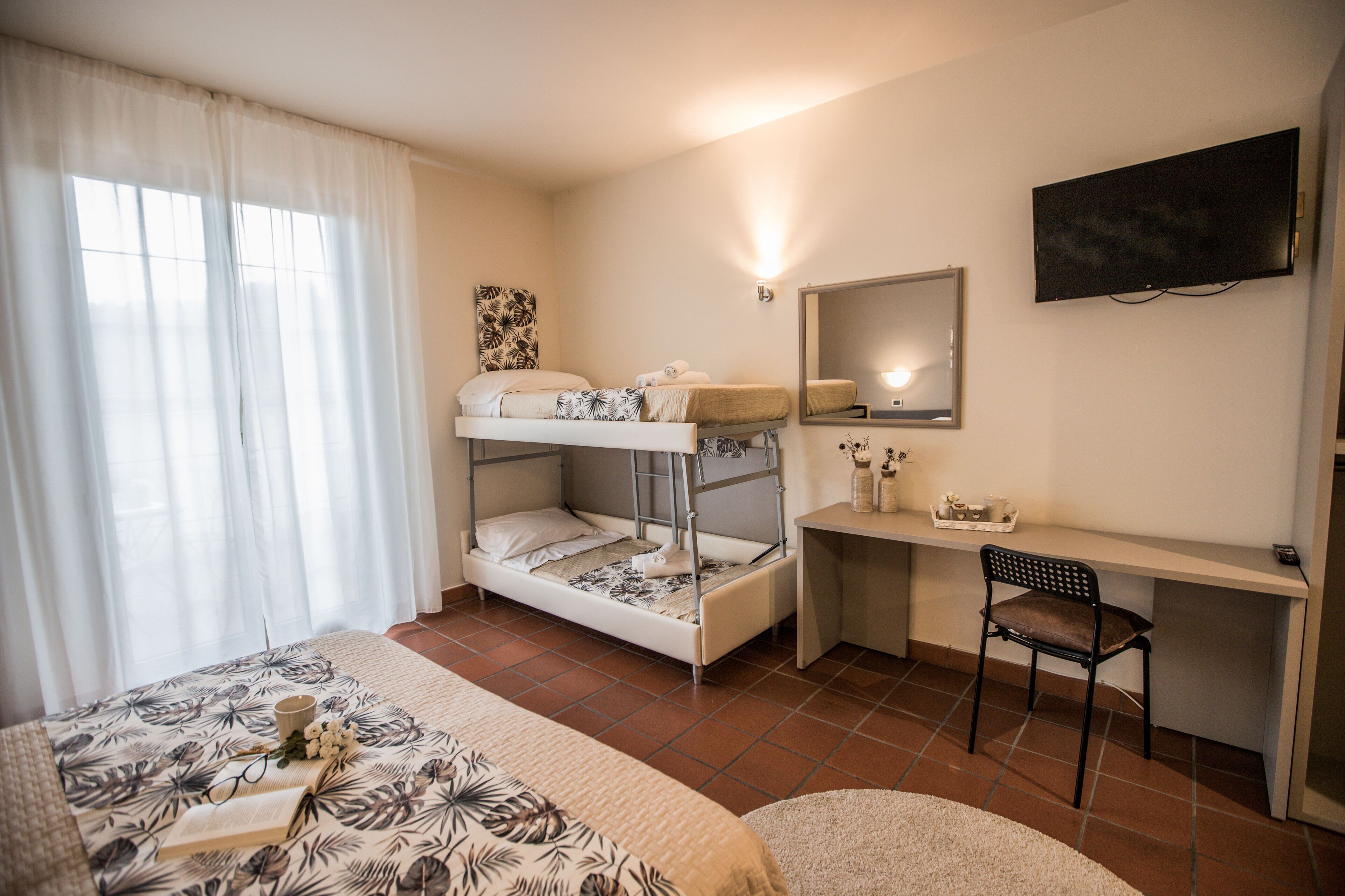 deluxe quadruple room | desk, laptop workspace, cots/infant beds, rollaway beds