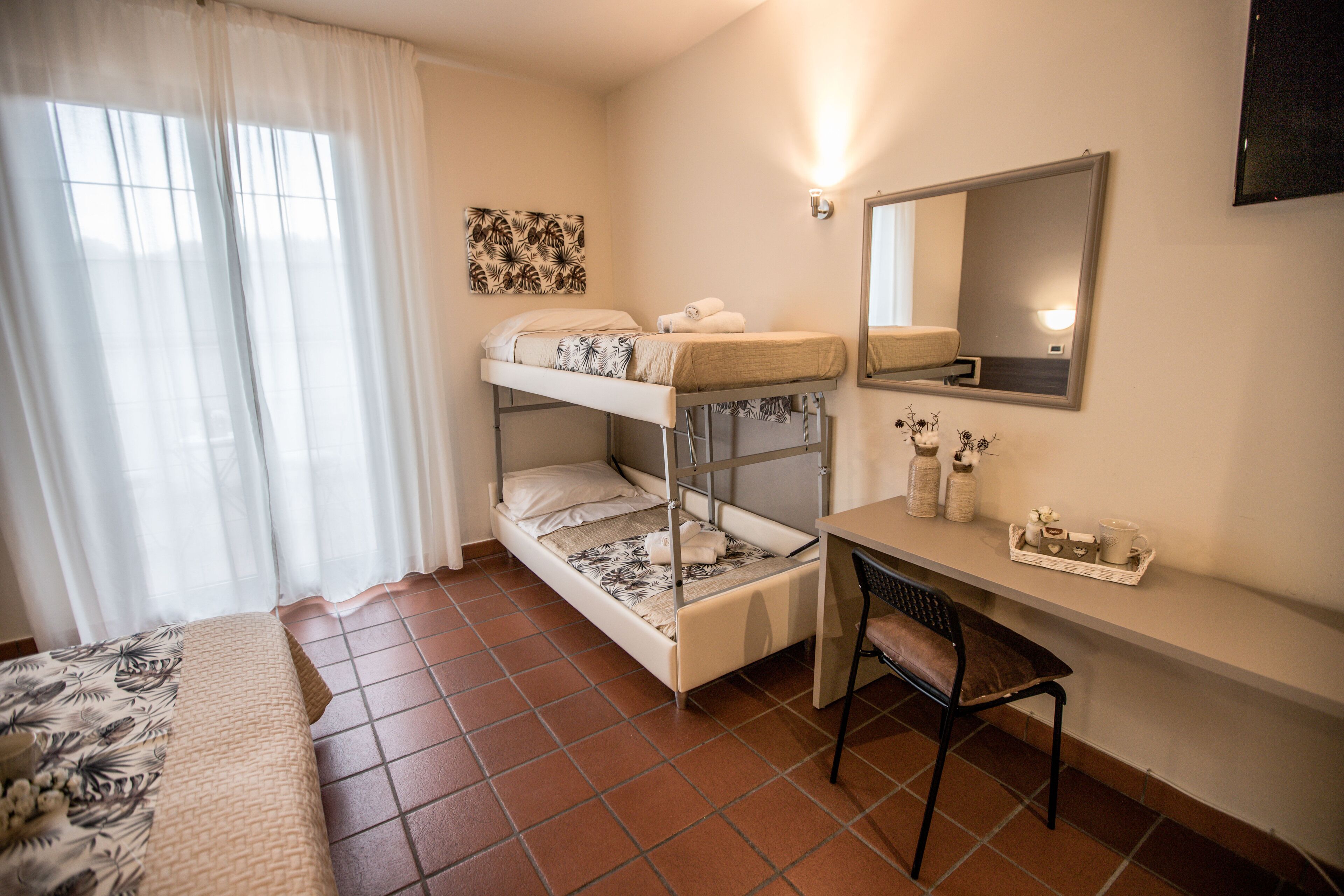 deluxe quadruple room | desk, laptop workspace, cots/infant beds, rollaway beds